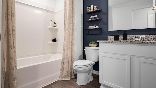 full bathroom with toilet, vanity, shower / bathtub combination with curtain, and hardwood / wood-style floors