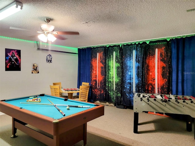 playroom featuring a textured ceiling and pool table