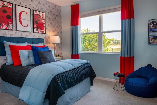 bedroom with baseboards and carpet floors