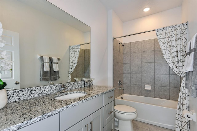 full bathroom with tile patterned floors, toilet, vanity, and shower / bath combo