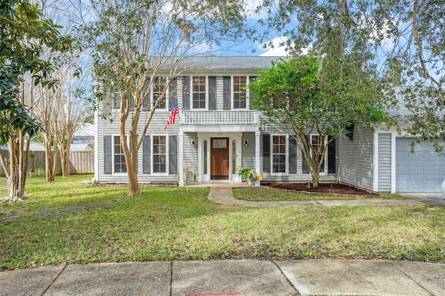 colonial house with a garage and a front yard