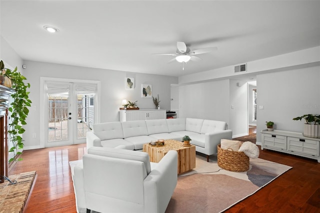 living room with ceiling fan, light hardwood / wood-style flooring, and french doors