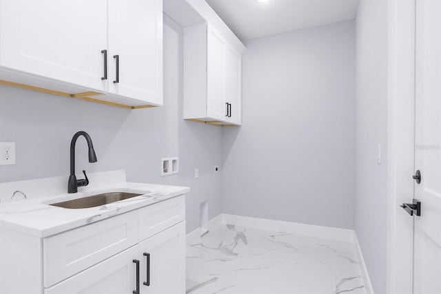 laundry area featuring hookup for a washing machine, sink, hookup for an electric dryer, and cabinets