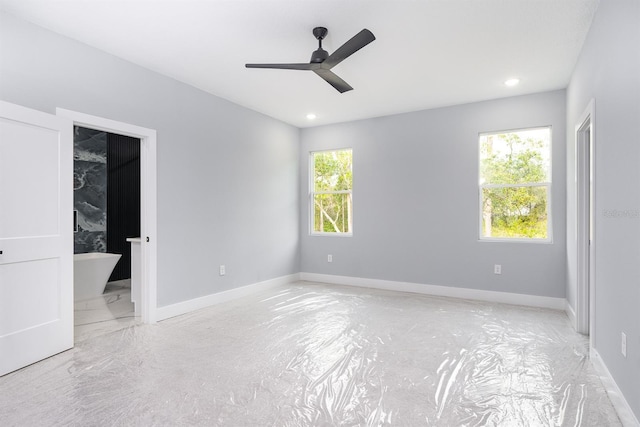 spare room featuring a wealth of natural light and ceiling fan