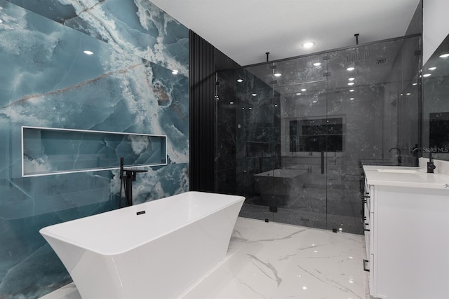 bathroom featuring shower with separate bathtub, tile walls, and vanity