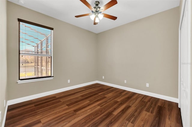 spare room featuring ceiling fan and dark hardwood / wood-style flooring