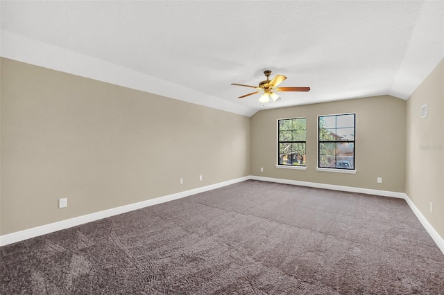 carpeted spare room with lofted ceiling and ceiling fan