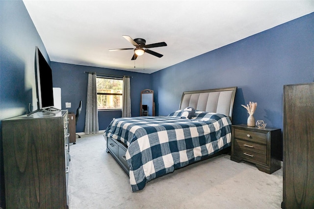 bedroom featuring light carpet and ceiling fan