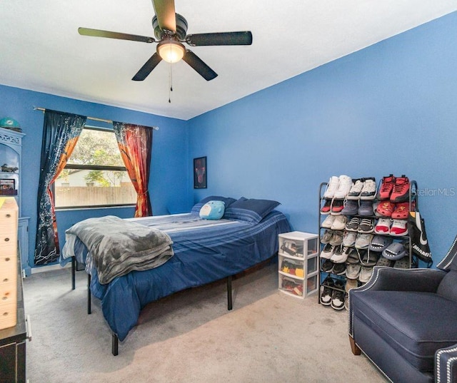 carpeted bedroom featuring ceiling fan