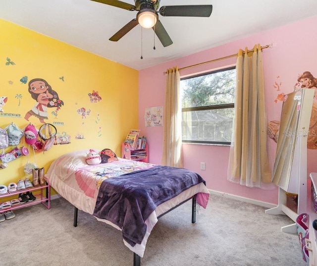 bedroom with light carpet and ceiling fan