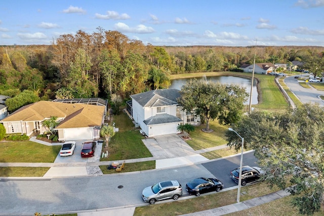 birds eye view of property with a water view