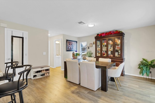 dining room featuring light wood-type flooring