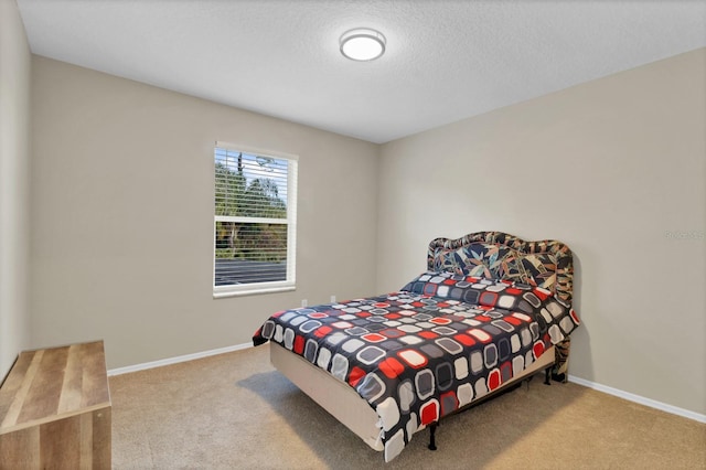 bedroom featuring light colored carpet