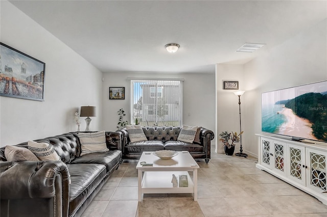 living room with light tile patterned flooring