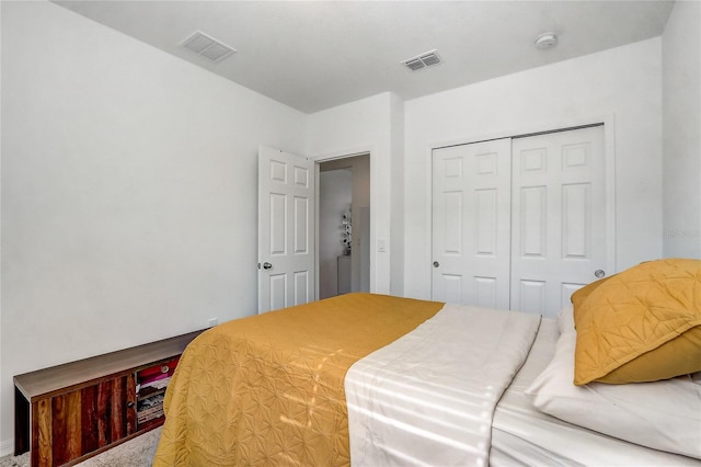 carpeted bedroom featuring a closet