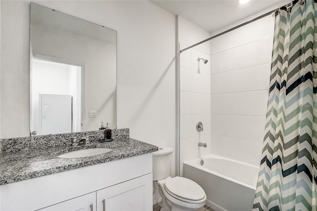 full bathroom with shower / bath combo with shower curtain, toilet, and vanity