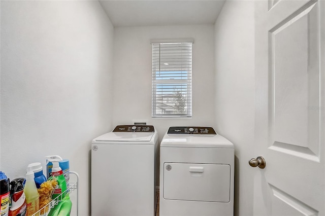 laundry area with separate washer and dryer