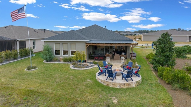 back of house with a patio, a yard, and a fire pit