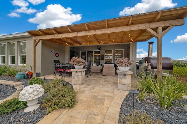 view of patio with ceiling fan and outdoor lounge area