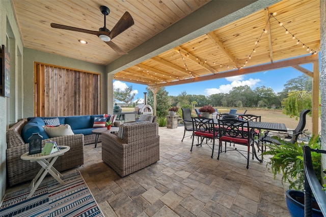 view of patio with ceiling fan, an outdoor hangout area, and exterior kitchen