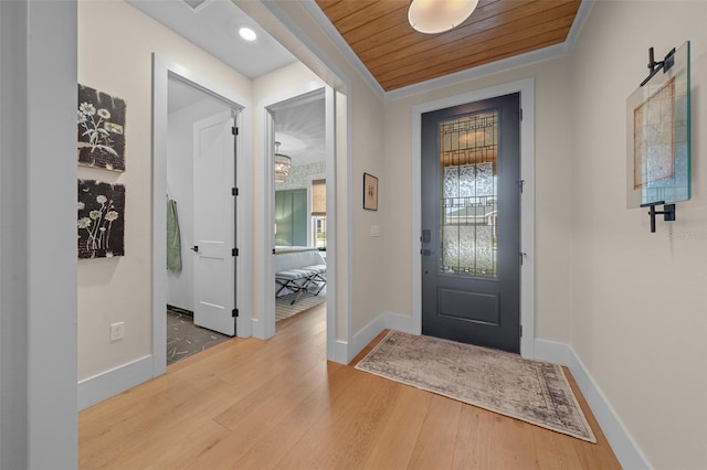 foyer entrance with wood ceiling and light hardwood / wood-style floors