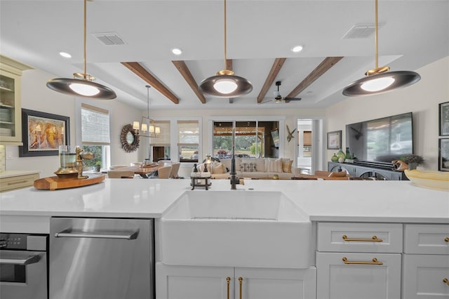 kitchen with sink, hanging light fixtures, beam ceiling, ceiling fan with notable chandelier, and stainless steel dishwasher