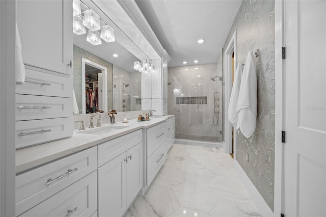 bathroom featuring vanity and an enclosed shower