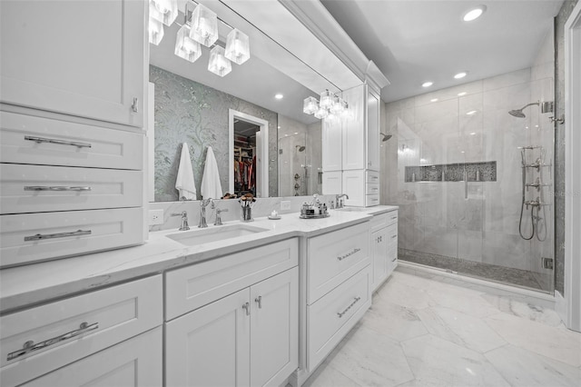 bathroom featuring vanity and an enclosed shower