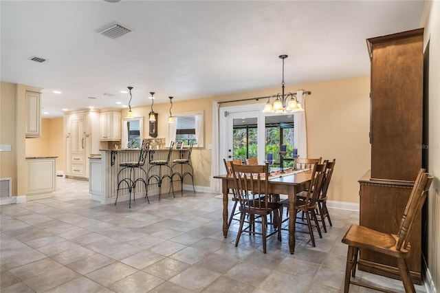 dining space with a notable chandelier