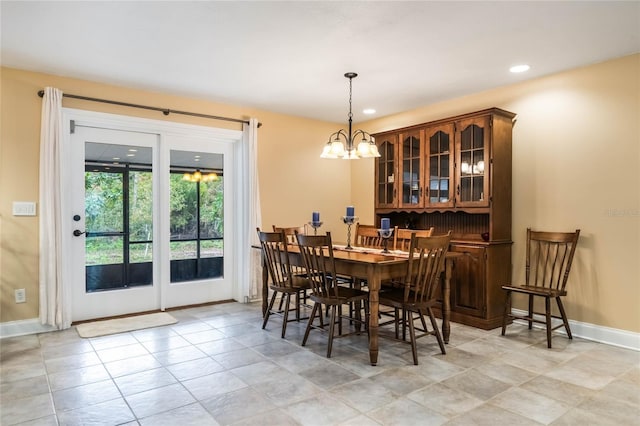 dining room with a notable chandelier