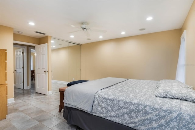 bedroom featuring ceiling fan and a closet