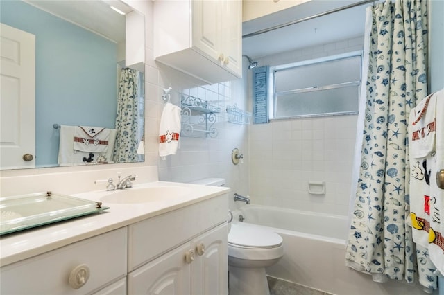 full bathroom featuring toilet, vanity, and shower / tub combo with curtain