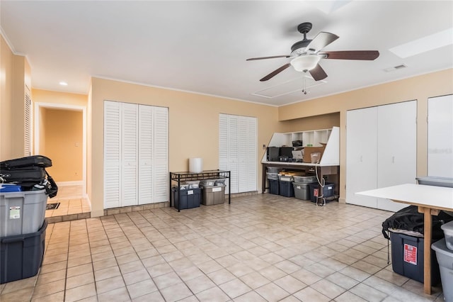 misc room featuring ceiling fan and light tile patterned floors