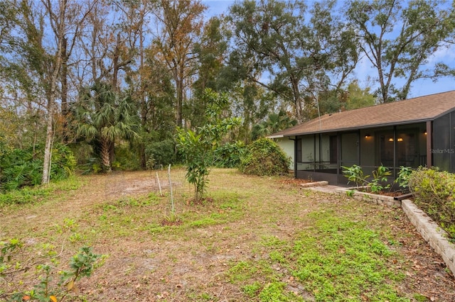 view of yard with a sunroom