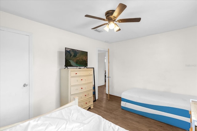 bedroom featuring dark hardwood / wood-style floors and ceiling fan