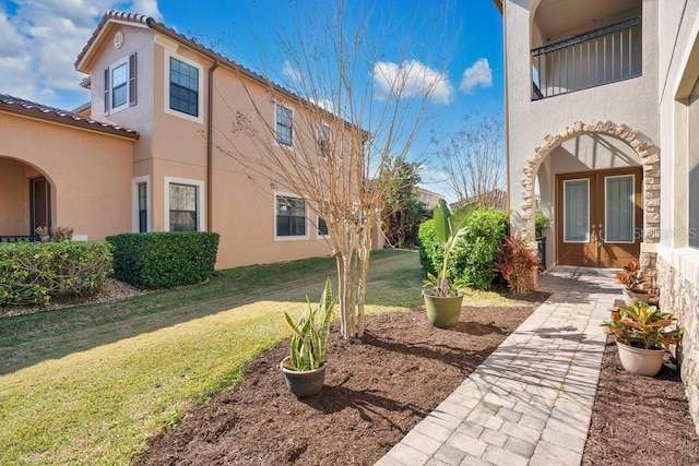 view of yard featuring french doors