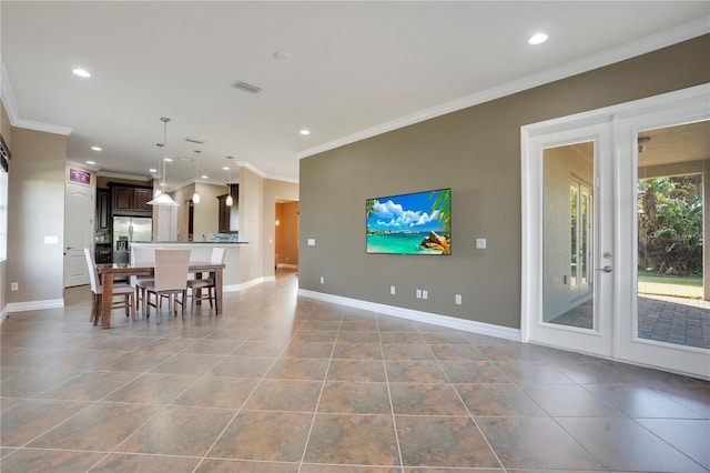 living room featuring french doors, ornamental molding, and light tile patterned floors