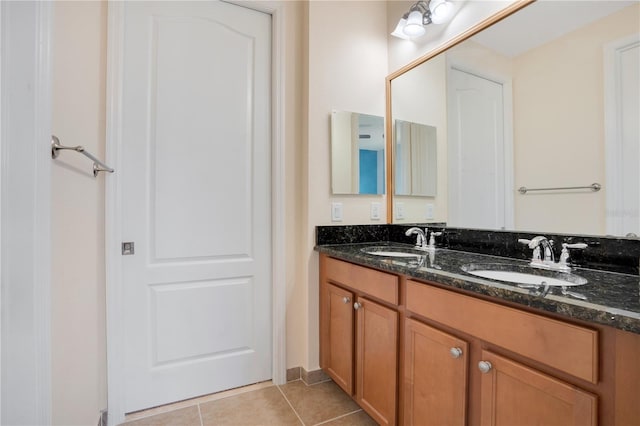 bathroom with vanity and tile patterned floors