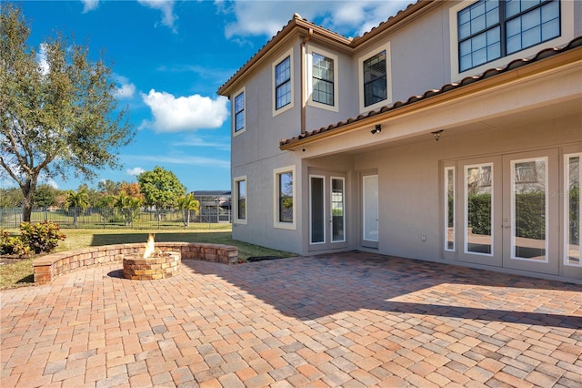 view of patio / terrace featuring an outdoor fire pit