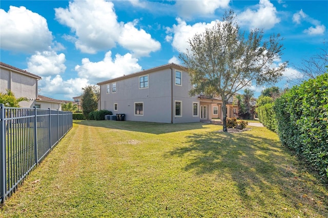 rear view of house with a lawn