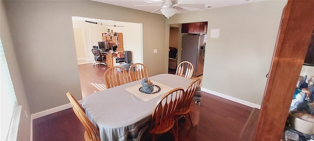 dining room with ceiling fan, wood finished floors, and baseboards