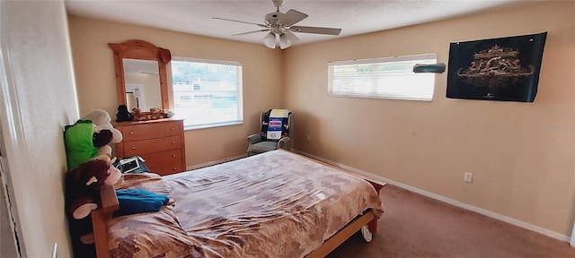 bedroom with carpet, ceiling fan, and baseboards