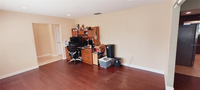 office space featuring baseboards, visible vents, dark wood-style flooring, and recessed lighting