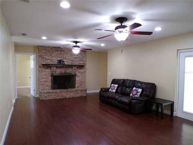 4131 Yorketowne Rd, Orlando, FL 32812 - living area with baseboards, wood finished floors, a ceiling fan, a brick fireplace, and recessed lighting