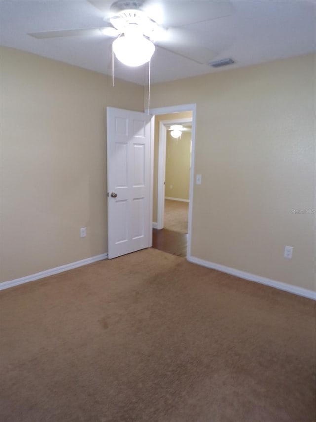 4131 Yorketowne Rd, Orlando, FL 32812 - spare room with ceiling fan, carpet flooring, and baseboards