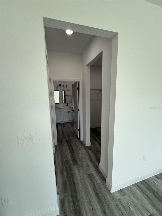 hallway with dark wood-type flooring