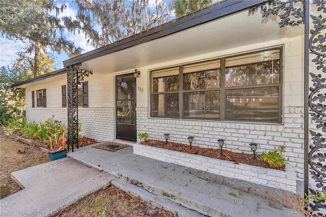 doorway to property featuring a patio area