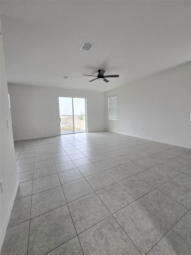 1603 Gardiner St, Haines City, FL 33844 - empty room with ceiling fan, light tile patterned floors, visible vents, and baseboards
