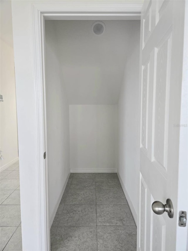 1603 Gardiner St, Haines City, FL 33844 - additional living space featuring lofted ceiling, light tile patterned floors, and baseboards