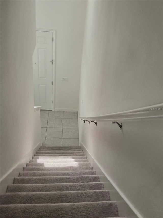 1603 Gardiner St, Haines City, FL 33844 - stairs with baseboards and tile patterned floors